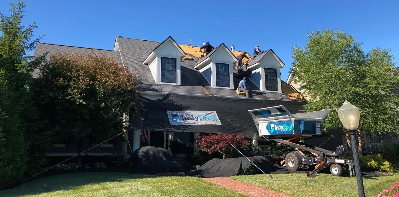 Emergency tarping on a Willow Branch roof